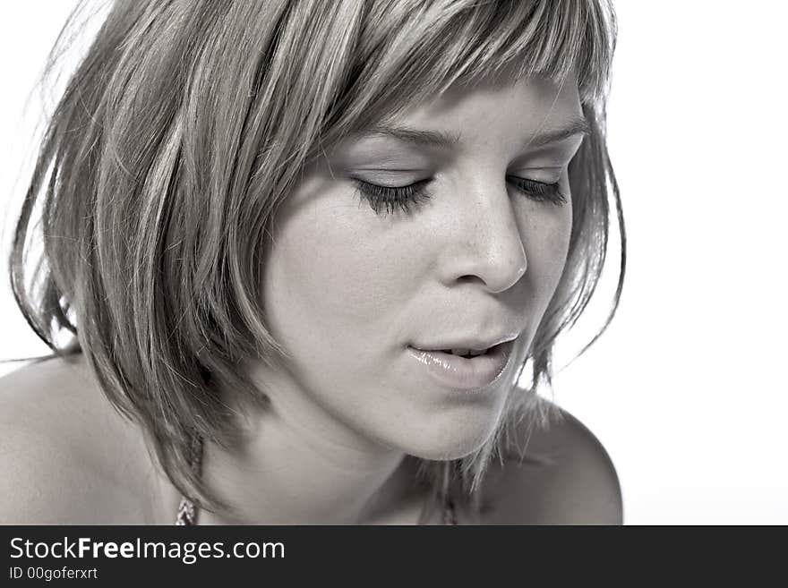 A young caucasian woman portrait taken in the studio on a white background. A young caucasian woman portrait taken in the studio on a white background