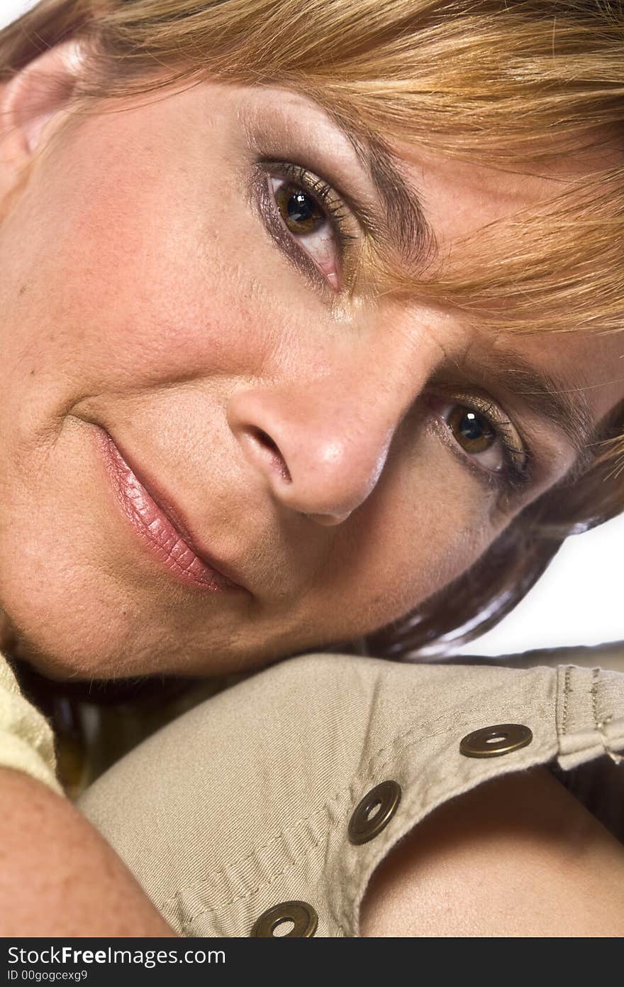 A adult caucasian woman portrait taken in the studio on a white background. A adult caucasian woman portrait taken in the studio on a white background