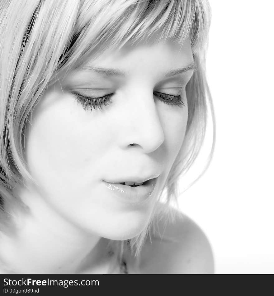 A young caucasian woman portrait taken in the studio on a white background. A young caucasian woman portrait taken in the studio on a white background