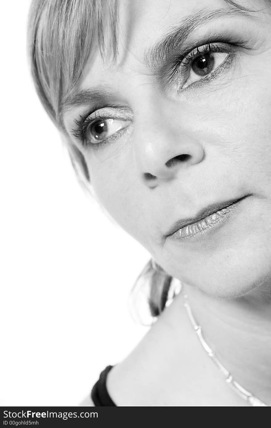 A adult caucasian woman portrait taken in the studio on a white background. A adult caucasian woman portrait taken in the studio on a white background