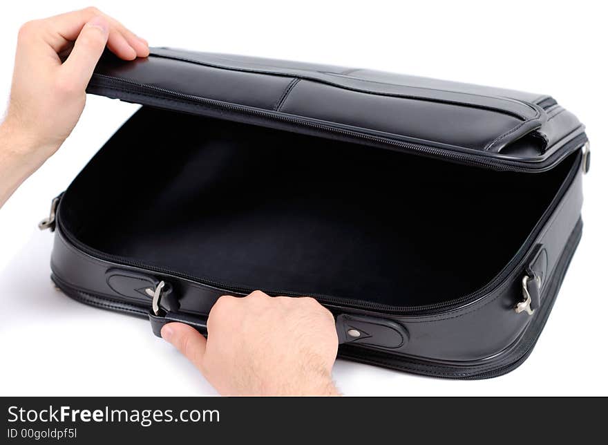 Male hands opening black briefcase over white background. Male hands opening black briefcase over white background