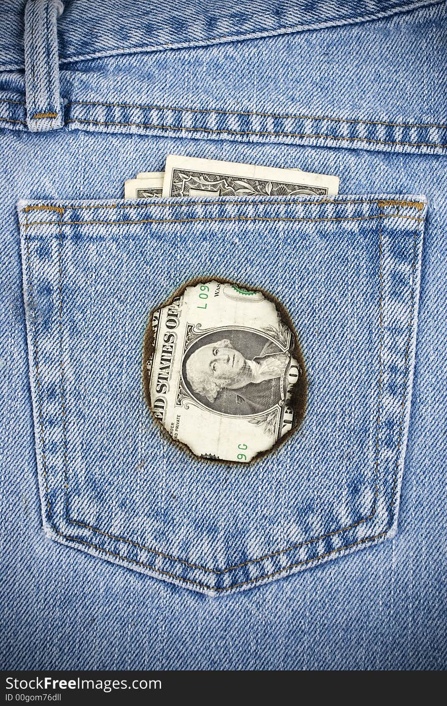 Closeup image of money burning a hole in your pocket.