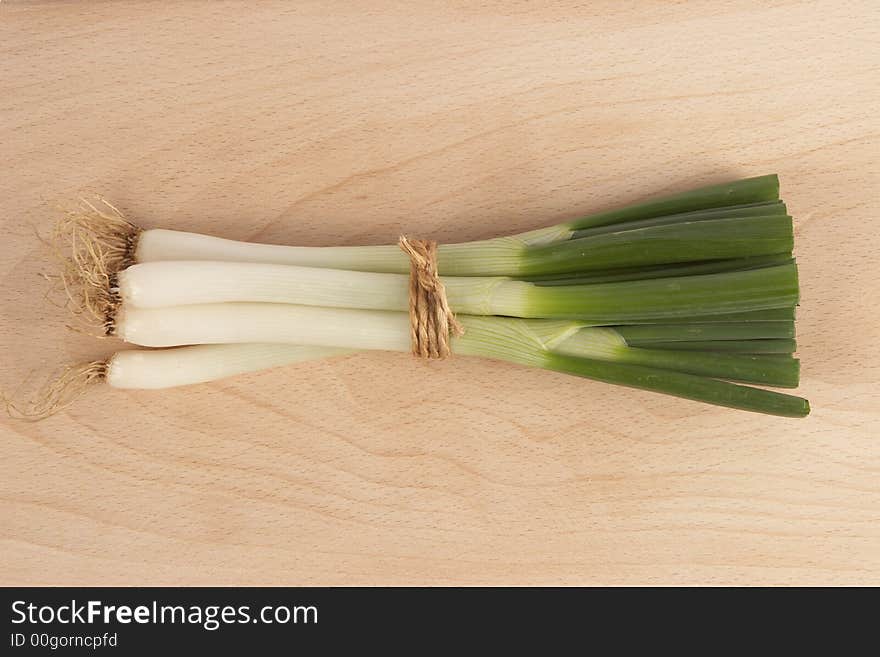 Fresh onion on a wooden bottom