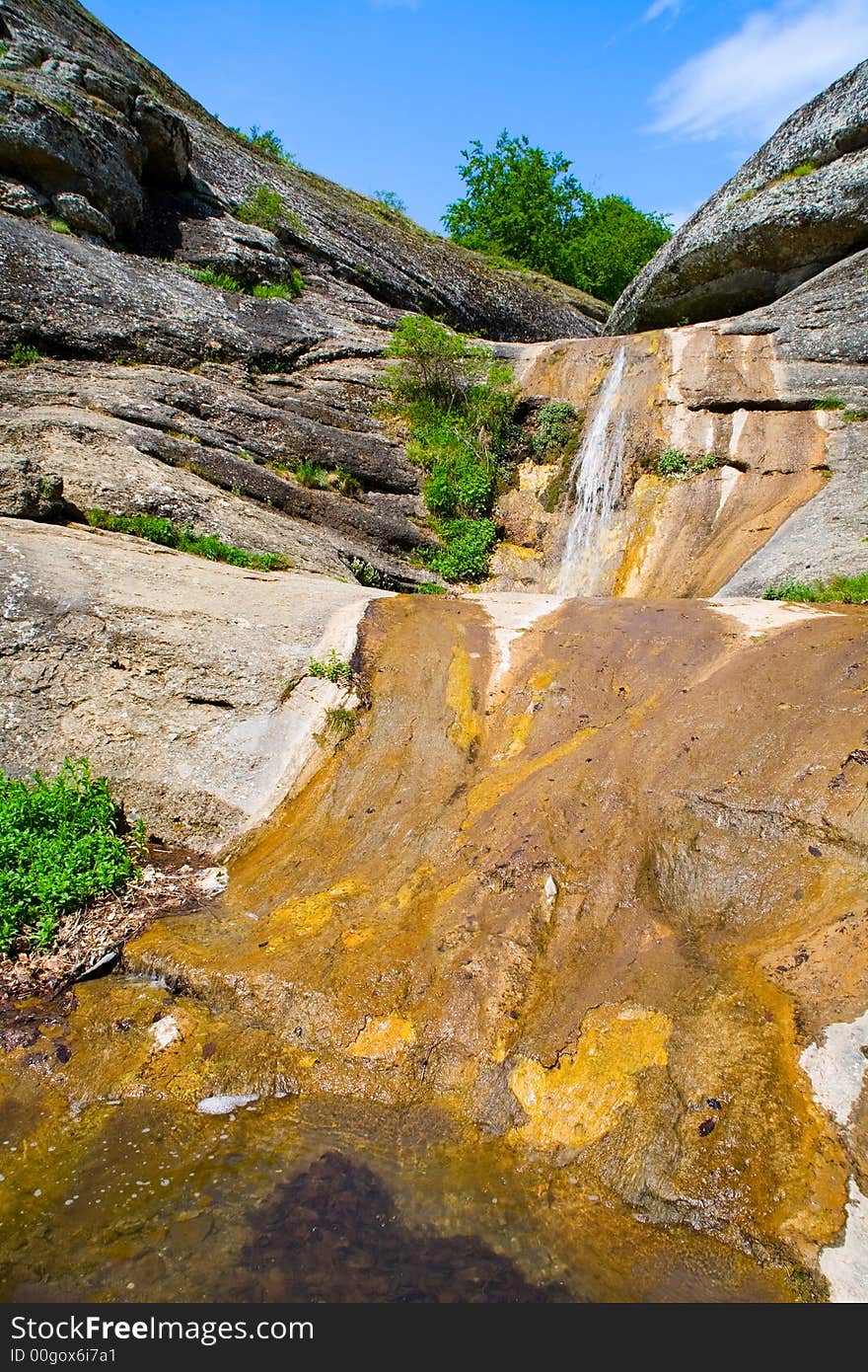 Dried waterfall in forest, summer, midday sun