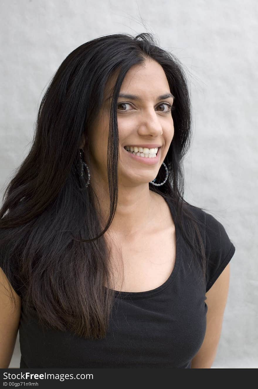 A beautiful woman of Indian descent smiling