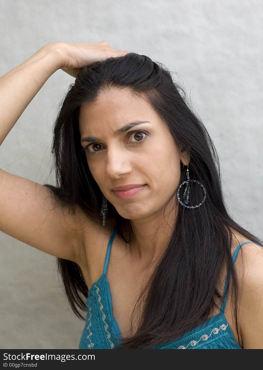 A portrait of a beautiful woman with hair pulled back