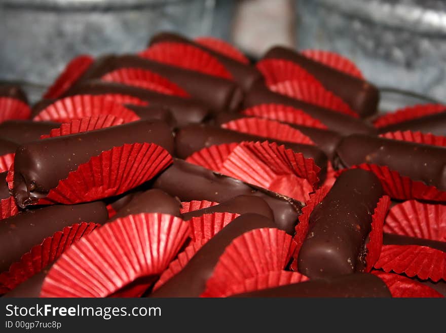 A pile of Cayenne chocolates in red wrappers