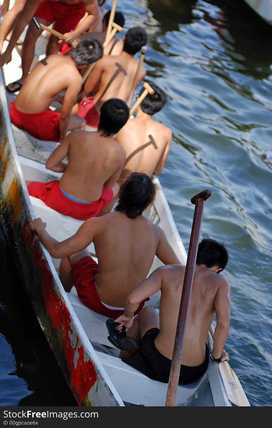 People practicing rowing at the seaside