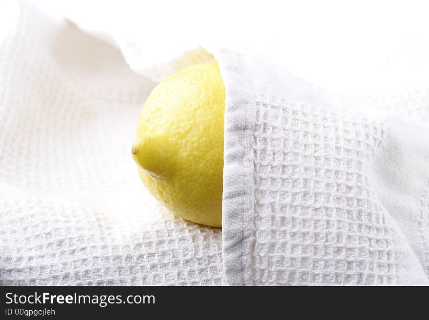 Lemon covered by white cloth