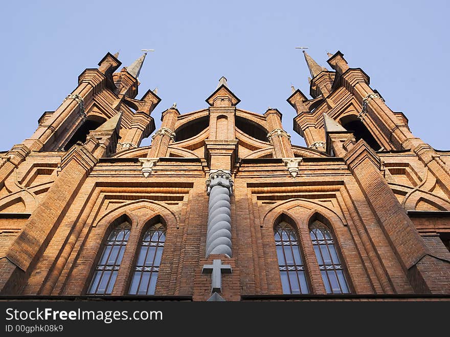 Catholic Church of red brick. The Gothic style