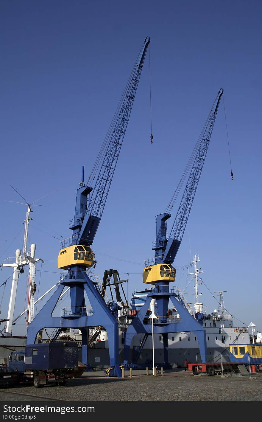 Blue and yelllow crane on dock