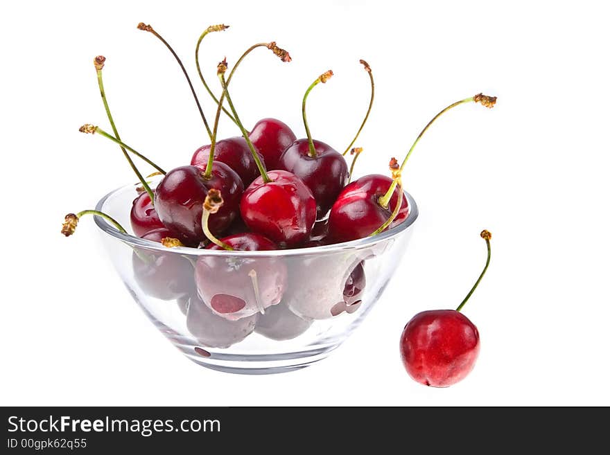 Cooled sweet cherries in drops of waters shined from below