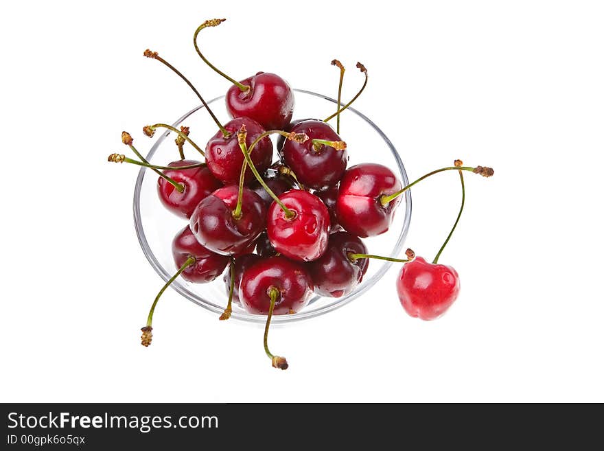 Cooled sweet cherries in drops of waters shined from below