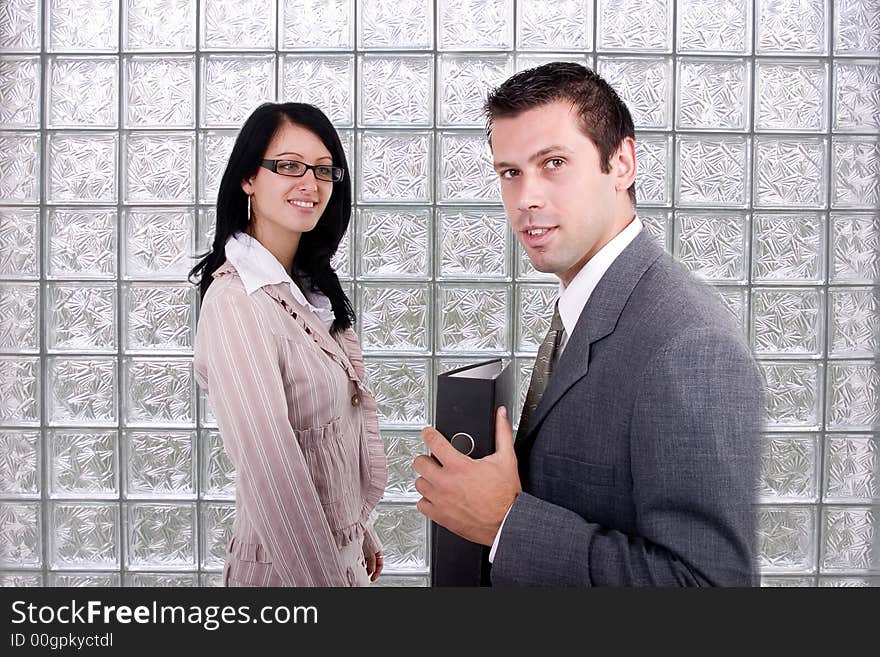 A business man and a girl are in front of a glass wall. A business man and a girl are in front of a glass wall