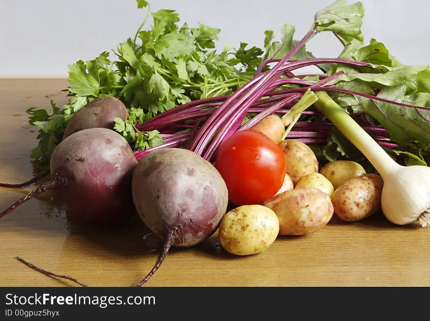 Fresh vegetables: garlic, carrot, parsley, tomato, potato, red beet