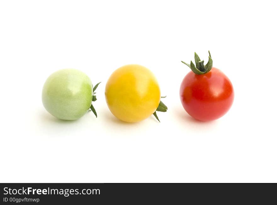 Green, yellow and red tomatoes