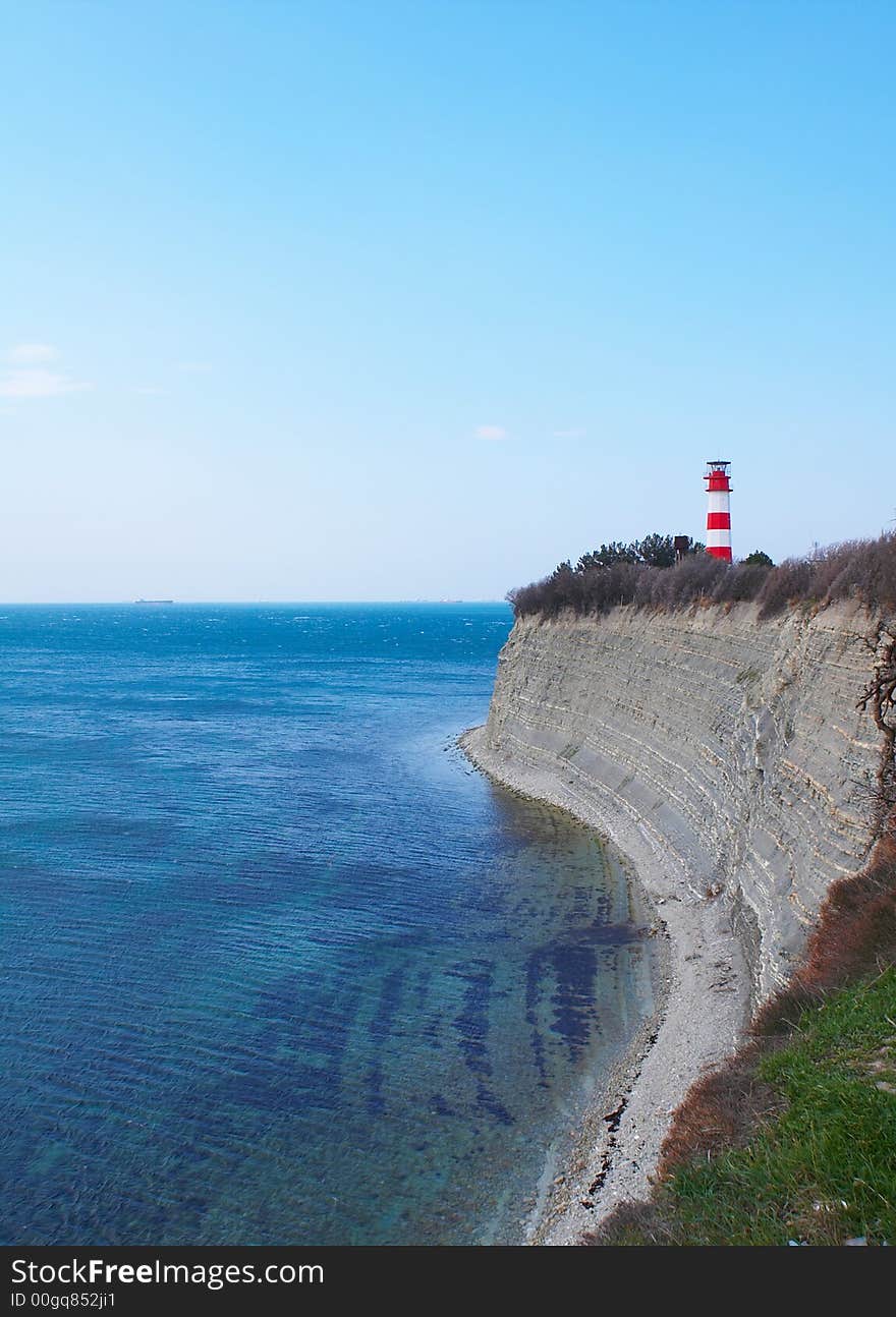 Beacon on high rocky coast. Beacon on high rocky coast