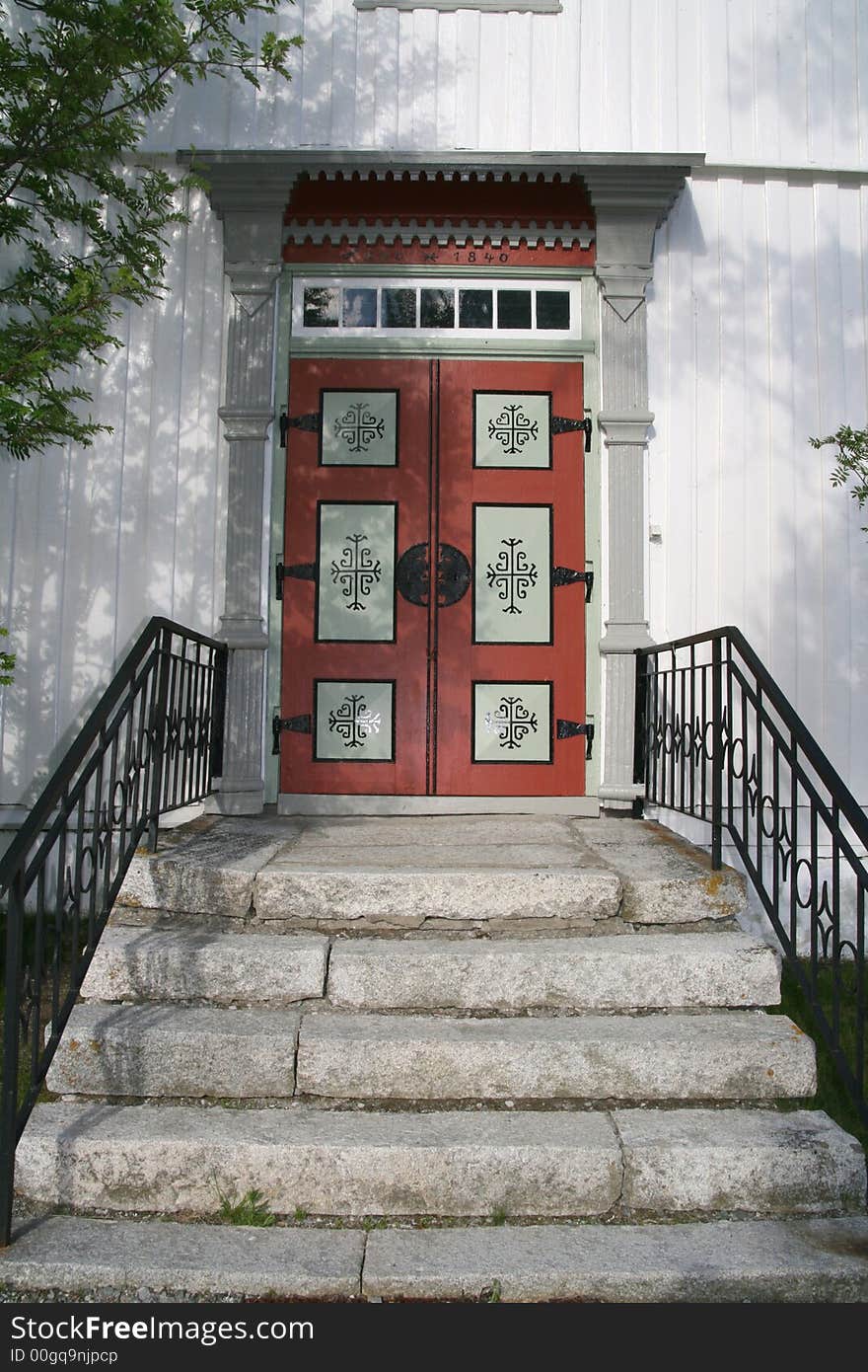 Stairs and door of a white Norwegian church. Stairs and door of a white Norwegian church