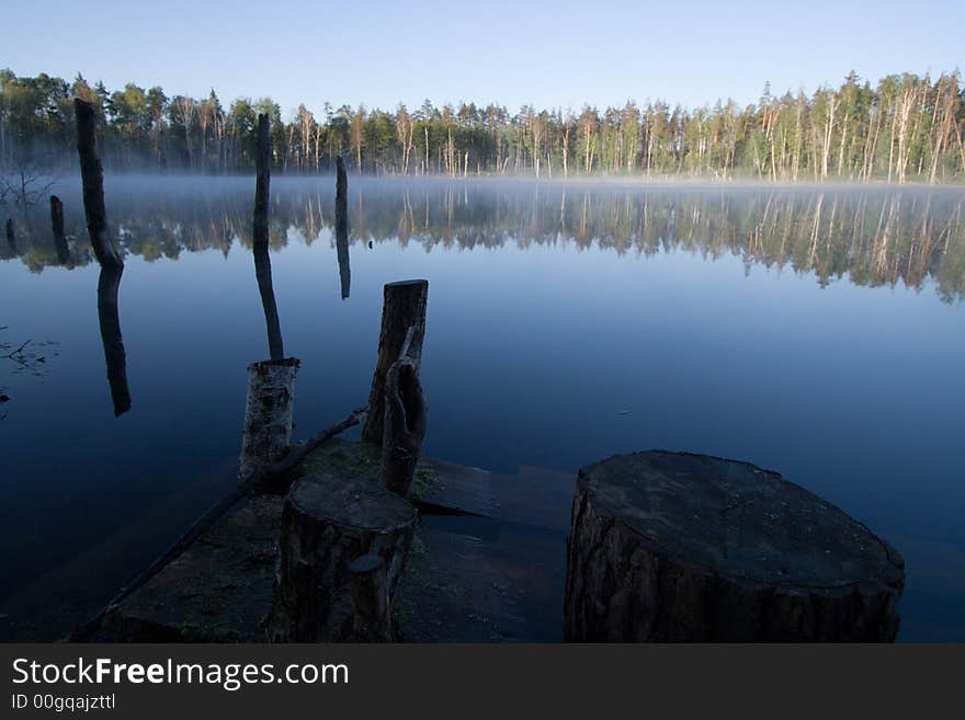 Lake with fog over it at sunrise. Lake with fog over it at sunrise