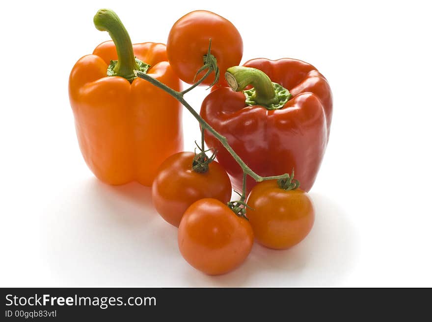 Red and orange peppers with tomatoes. Red and orange peppers with tomatoes