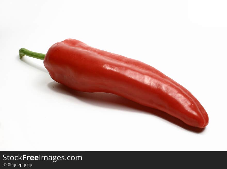 A red pepper isolated on a white background.