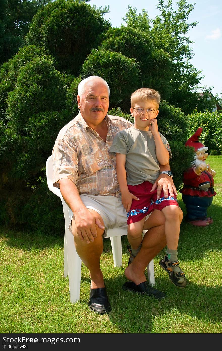 Grandfather and grandson spend time together in the park.