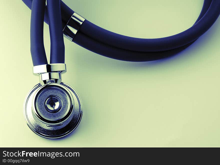 Medical stethoscope in developed kind on surface of table, close-up. Medical stethoscope in developed kind on surface of table, close-up