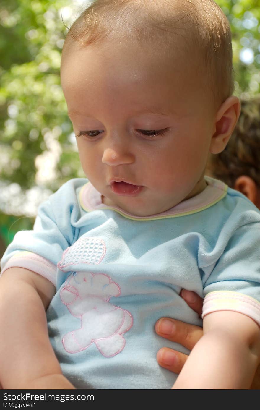 Baby boy outdoor portrait in natural light. Baby boy outdoor portrait in natural light