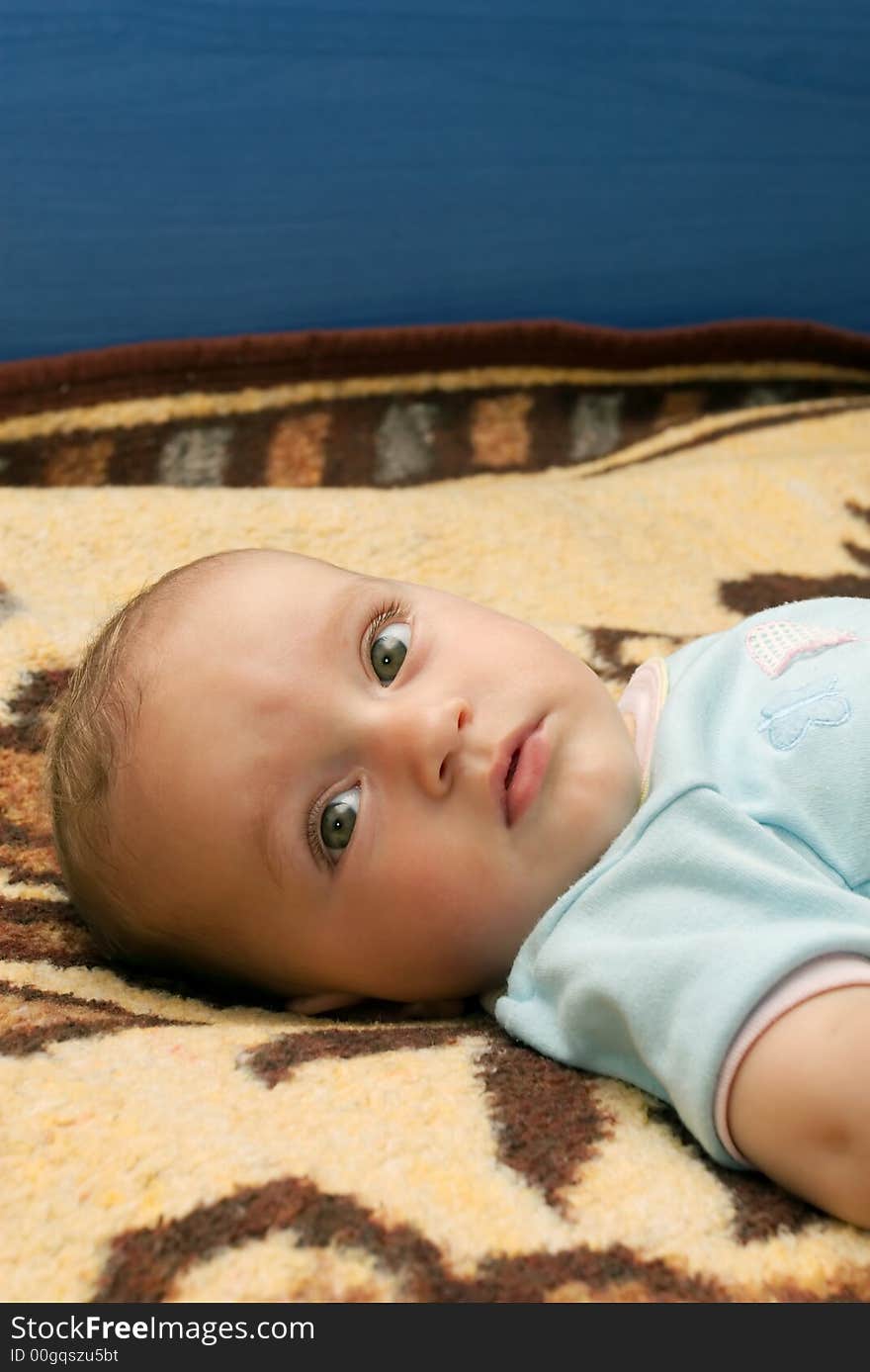 Cute baby boy head portrait in bed