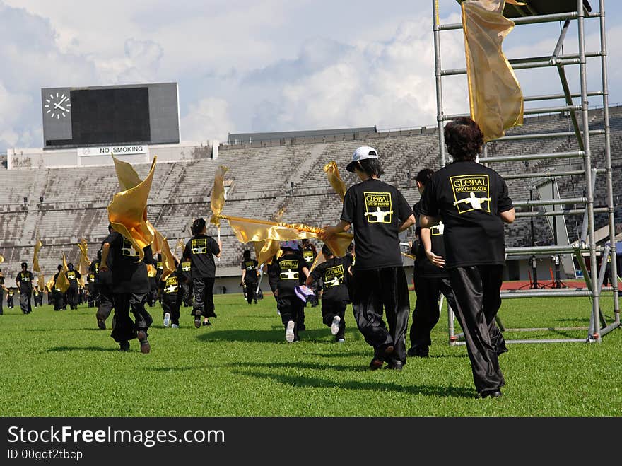 Performers practicing in the stadium