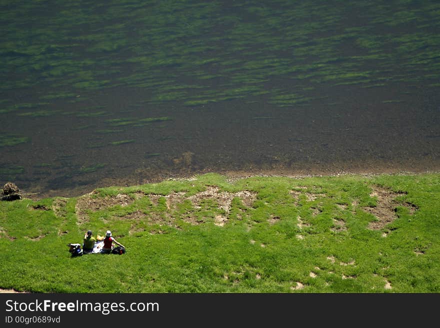 People having a picnic on gras