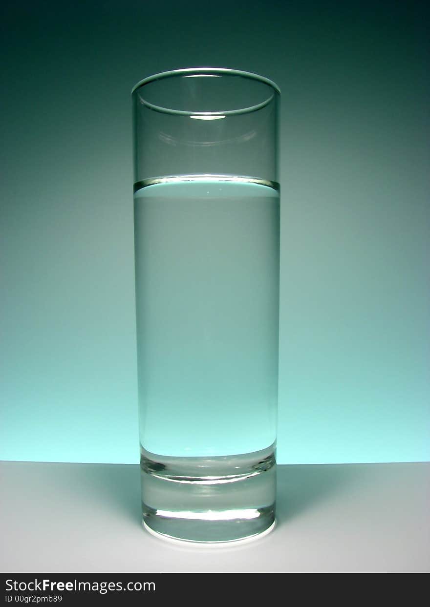 Glass with cold water ,glas background.