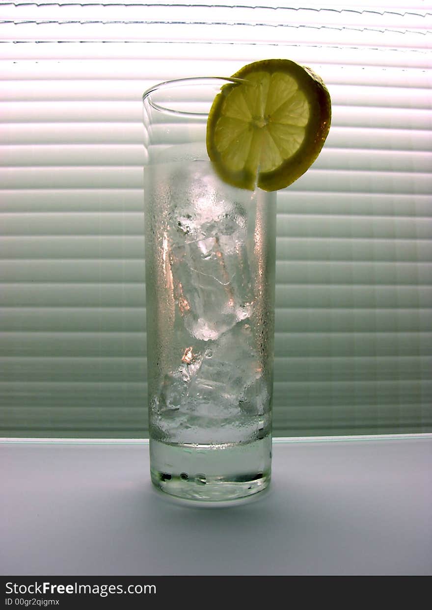 Glass with cold water and an ice