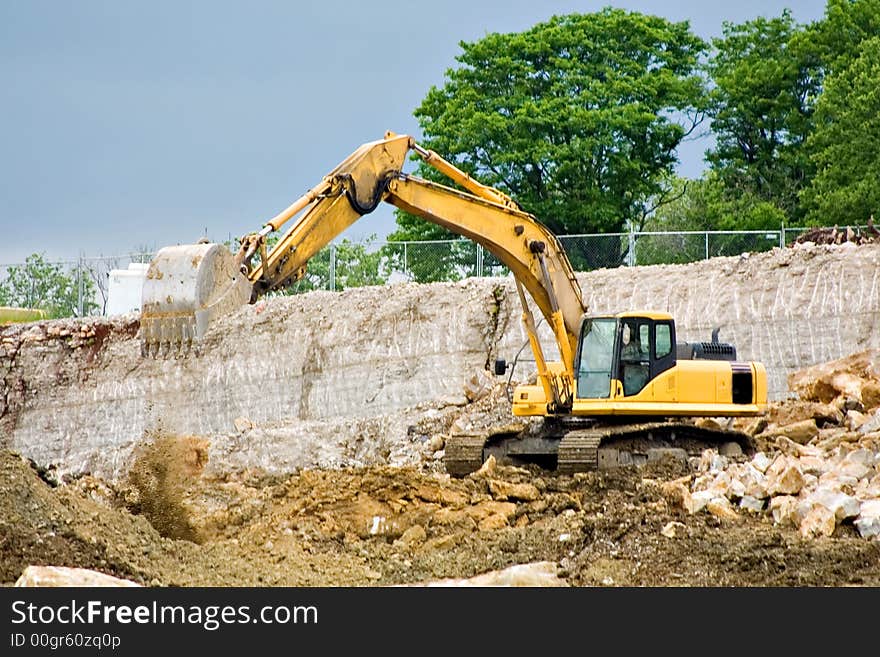 Backhoe Dumping Dirt