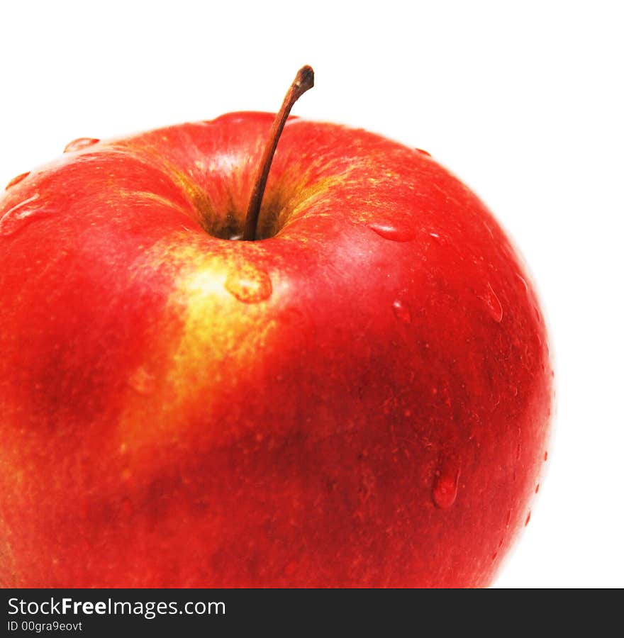 Apple with water drops isolated on white