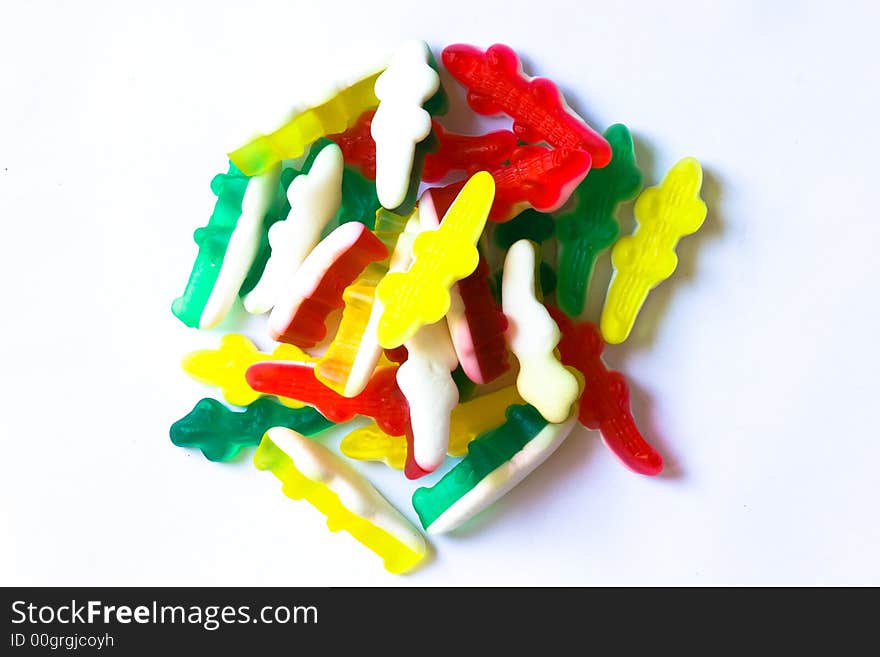 Mix of coloured crocodile candy isolated on white background. Mix of coloured crocodile candy isolated on white background