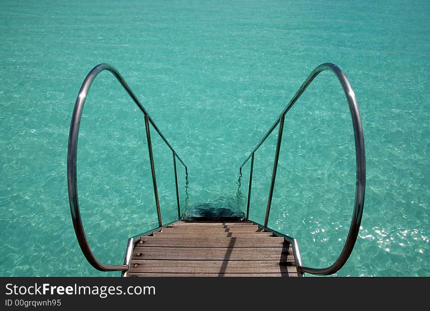 Ladder into the turquoise indian ocean. Ladder into the turquoise indian ocean