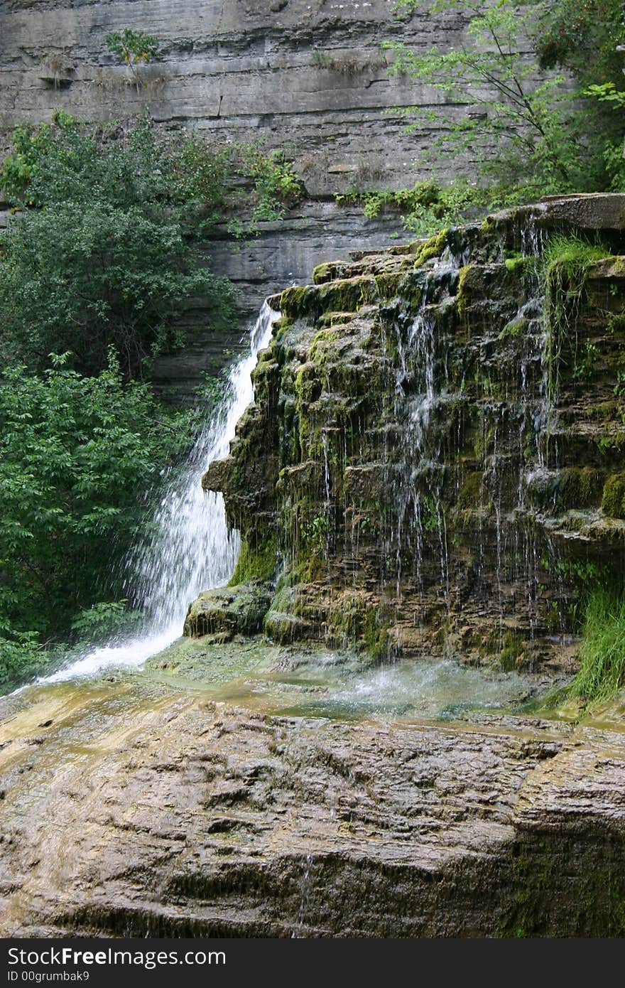New York Waterfall near Ithica, beautiful landscape. Lush greenery adds viberant color.