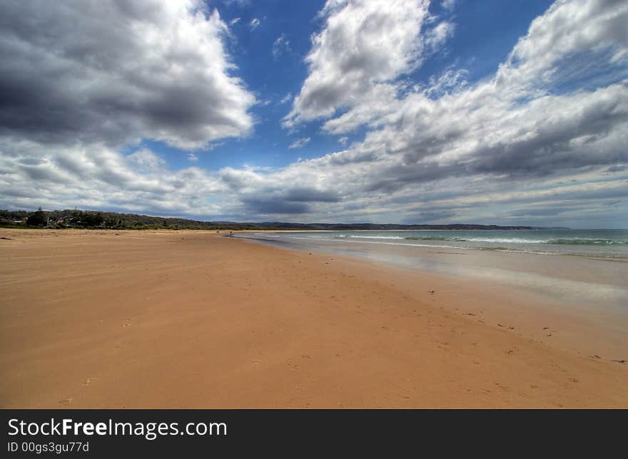 Tathra beach in Australia with blue sky and clouds