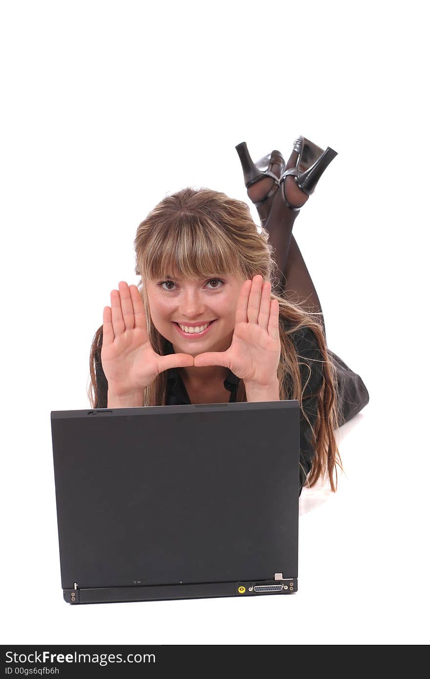 Beautiful smiling girl with laptop framing face. Beautiful smiling girl with laptop framing face