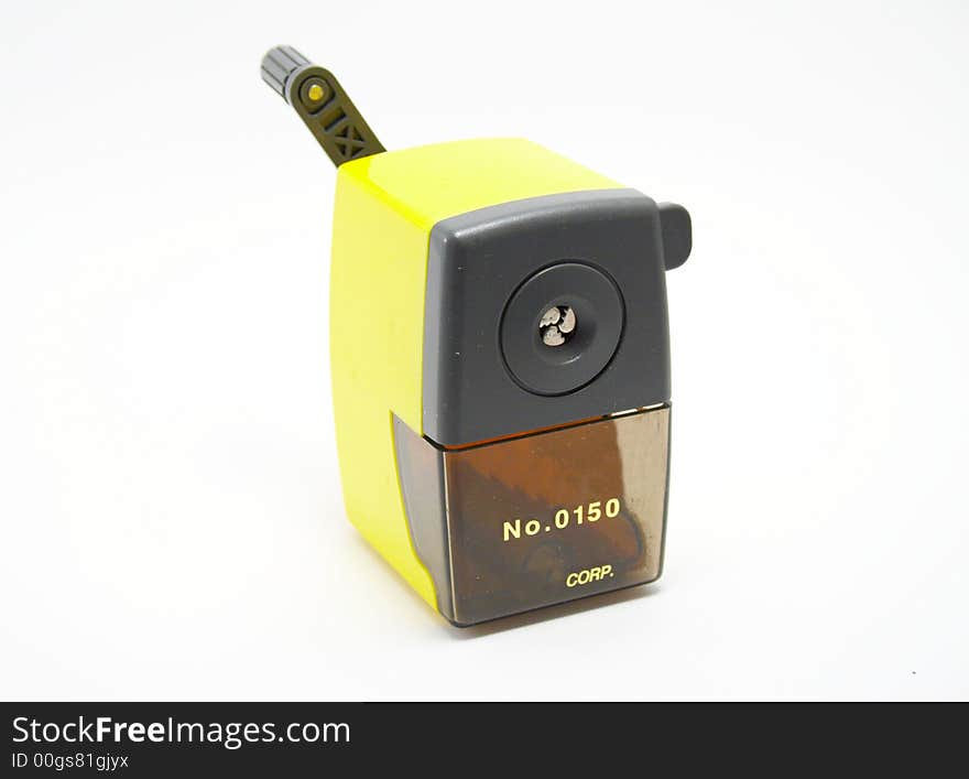 Yellow sharpener on a white background