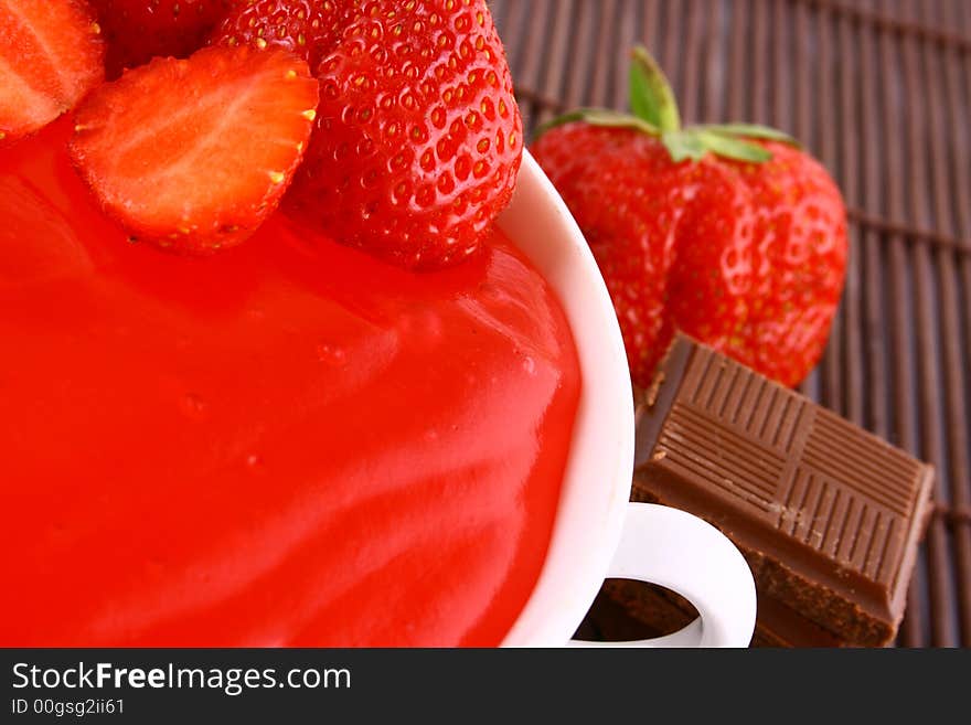 Strawberry jelly with mint leaf as garnish. Strawberry jelly with mint leaf as garnish