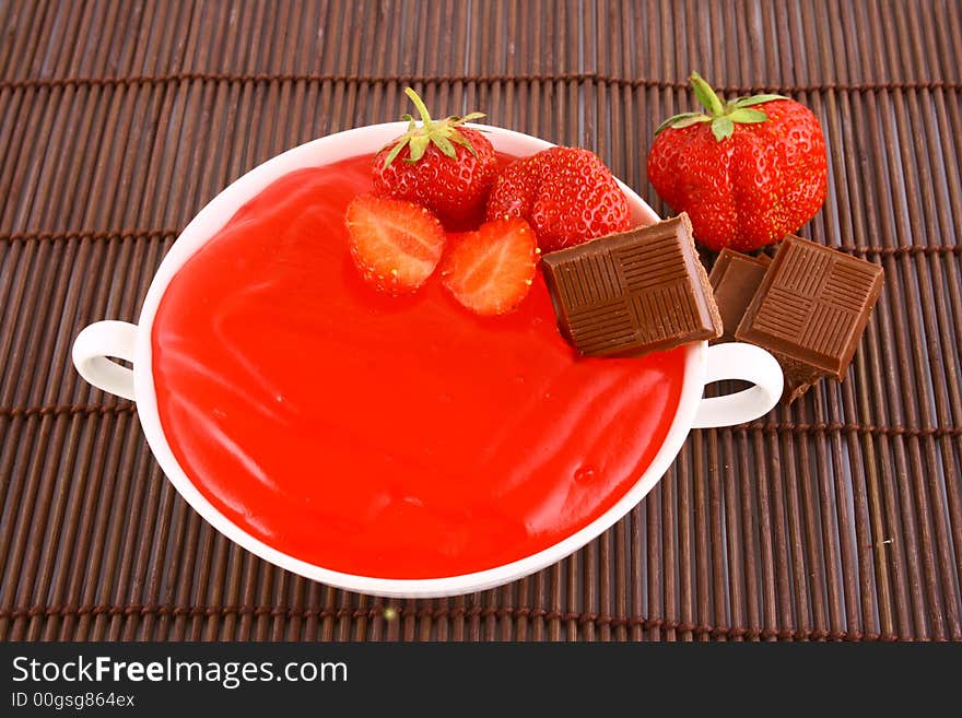 Strawberry jelly with mint leaf as garnish. Strawberry jelly with mint leaf as garnish