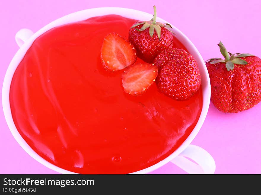 Strawberry jelly with mint leaf as garnish. Strawberry jelly with mint leaf as garnish