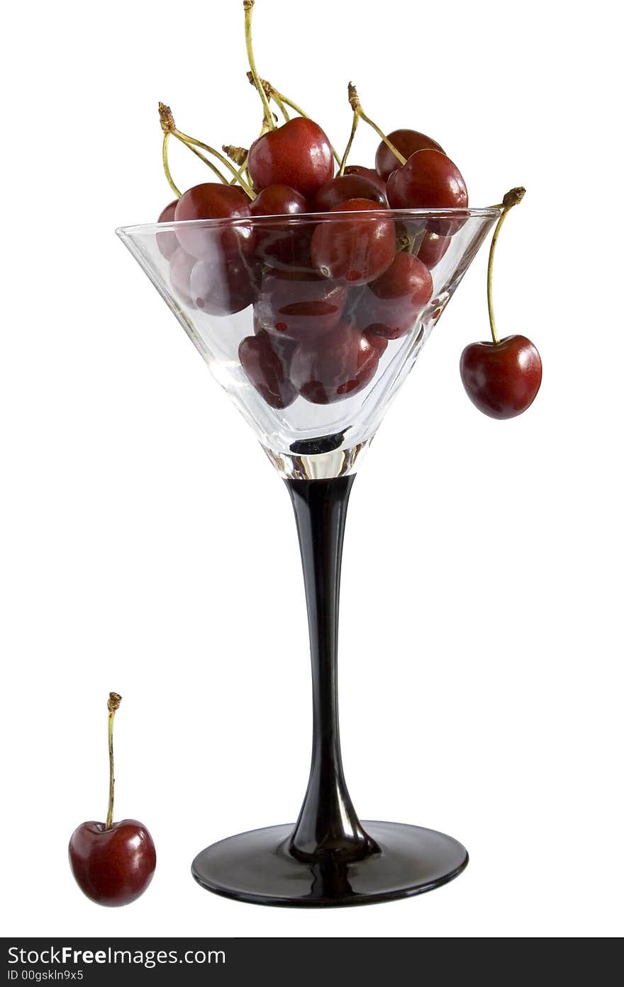 Cherries in goblet on white isolated