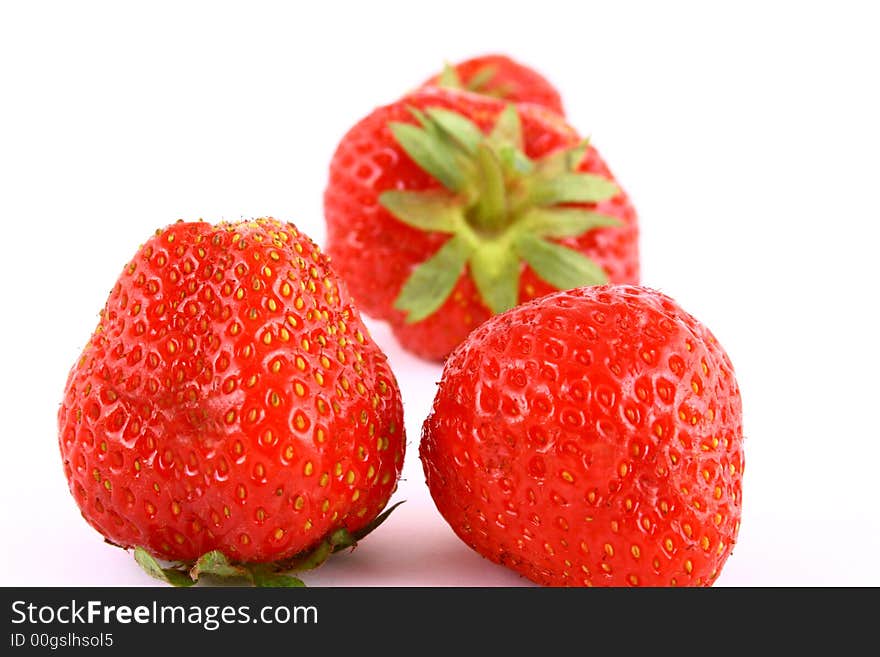 Bunch of red strawberries isolated over white. Bunch of red strawberries isolated over white