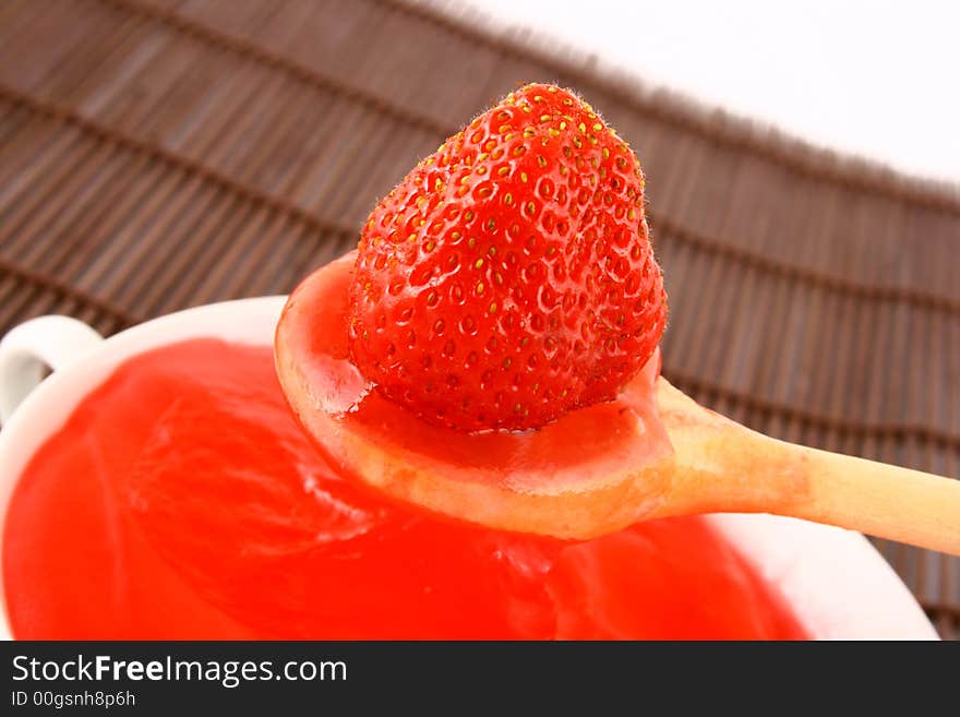 Strawberry Jam on a white background-red strawberry. Strawberry Jam on a white background-red strawberry