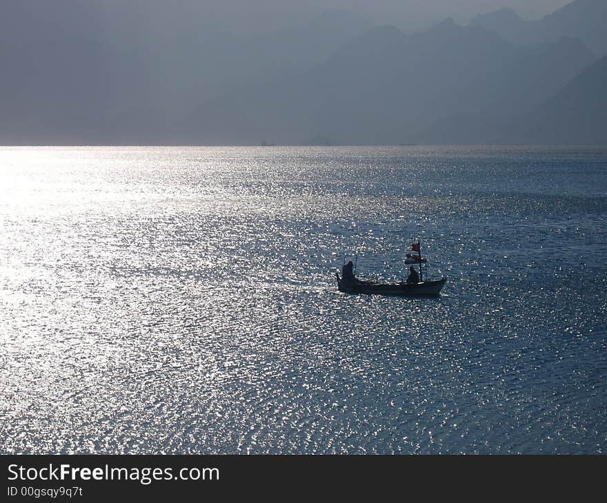 Turkish fishing boat heading for habour. Turkish fishing boat heading for habour