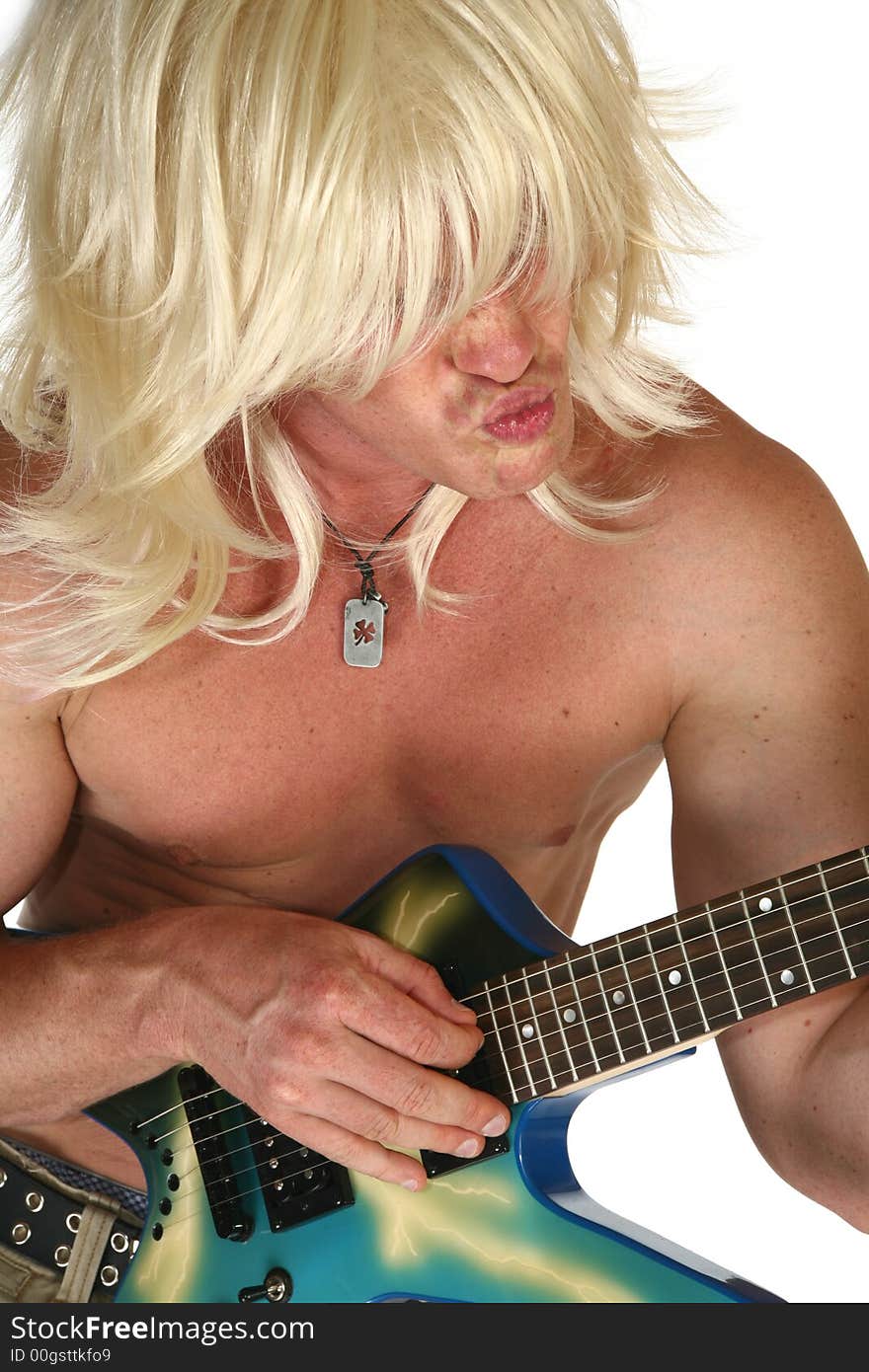 Man with long blonde hair playing guitar over white. Man with long blonde hair playing guitar over white.