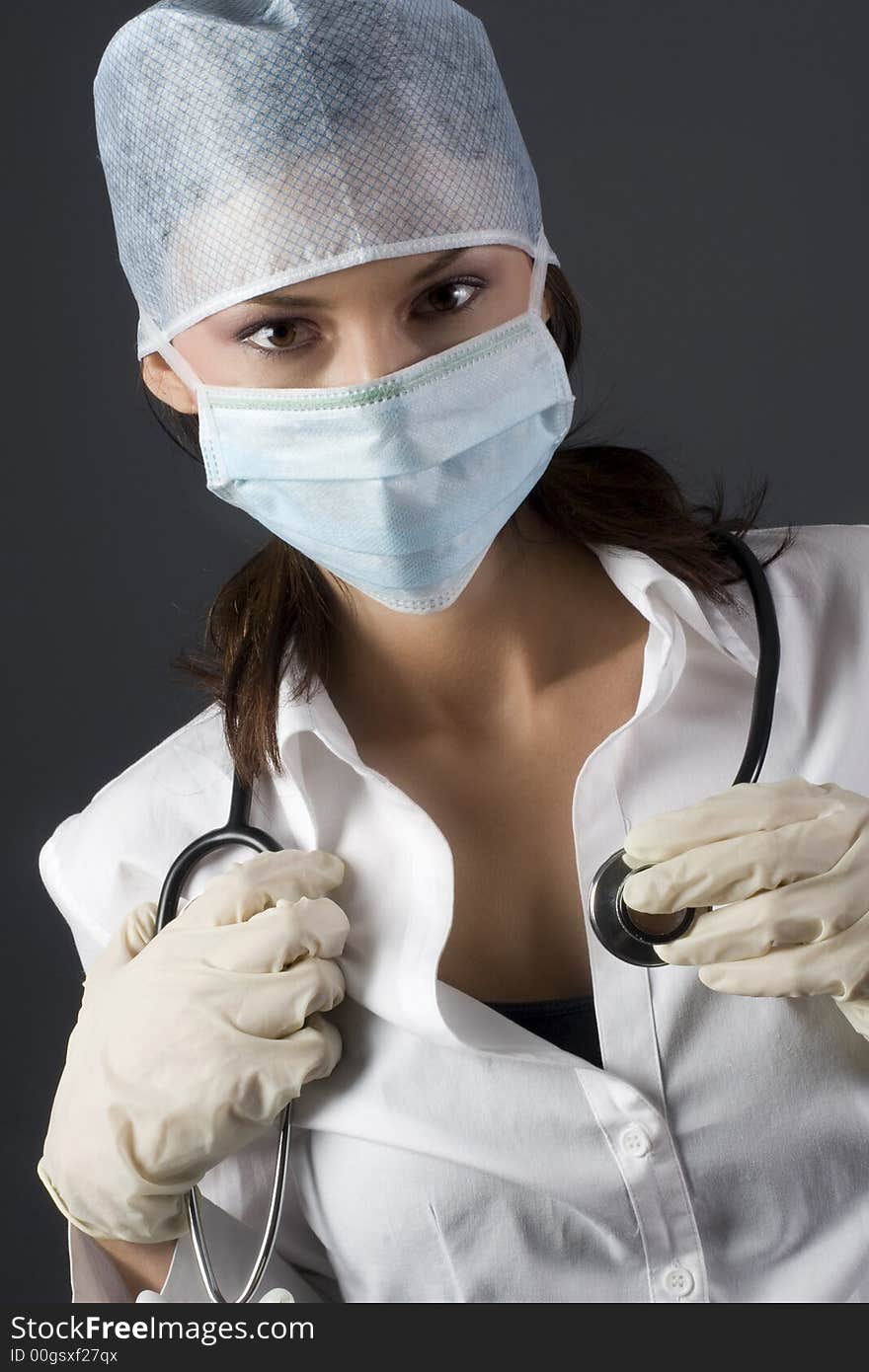 Female doctor with stethoscope about to listen to heart rate